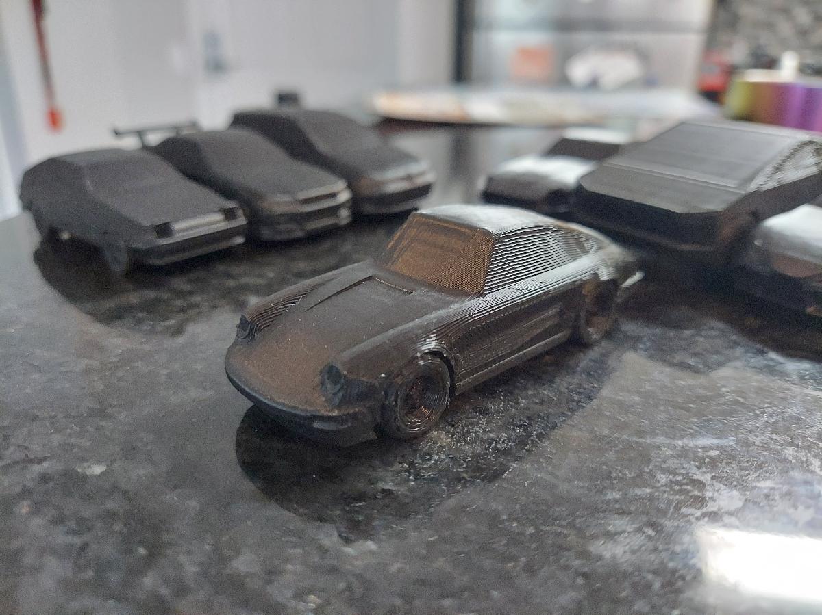 Porsche 911 classico com rodas impressas no lugar