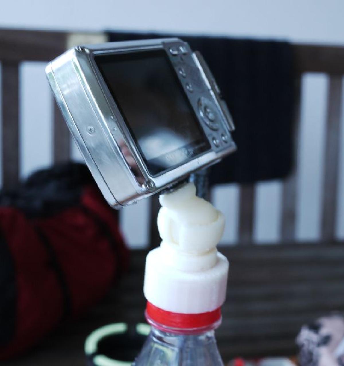 Suporte de camera para garrafas de bebida