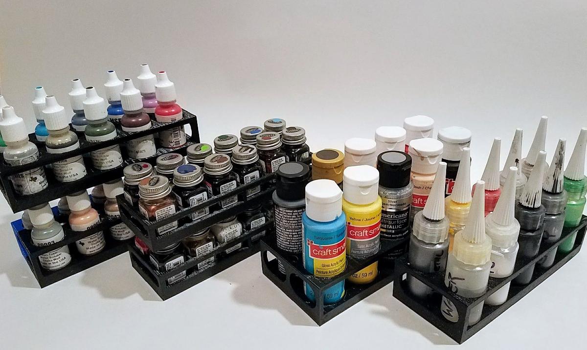 Suportes para garrafas de tinta