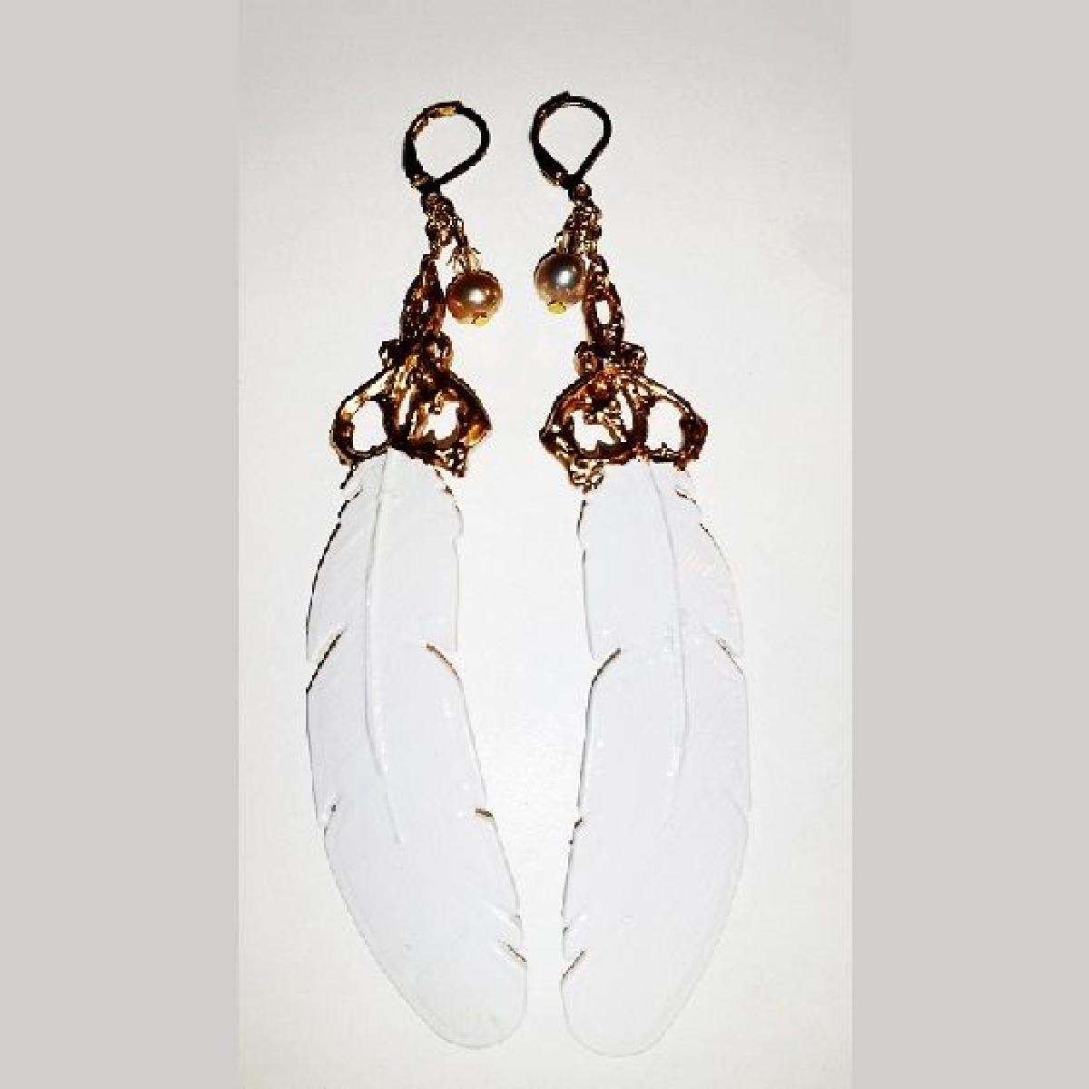 Brincos de filigrana de pena