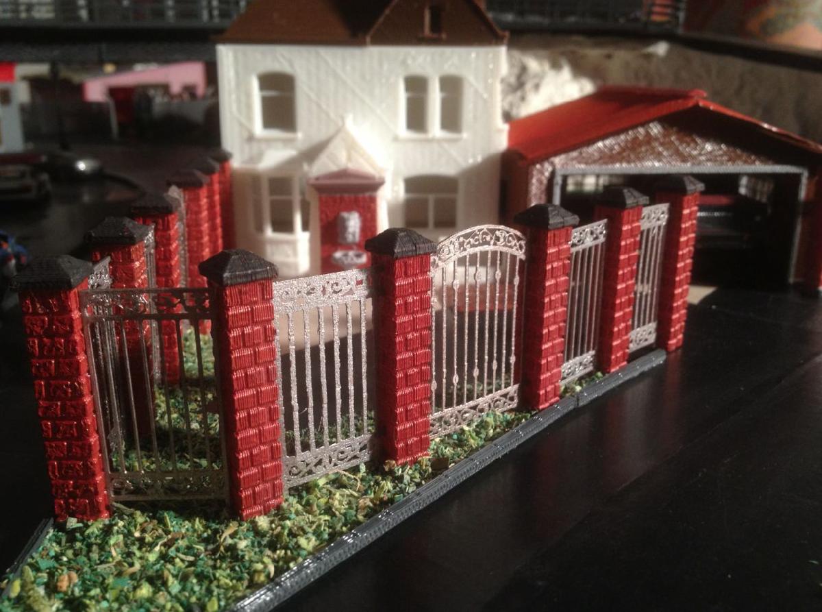 brick and wrought iron fence