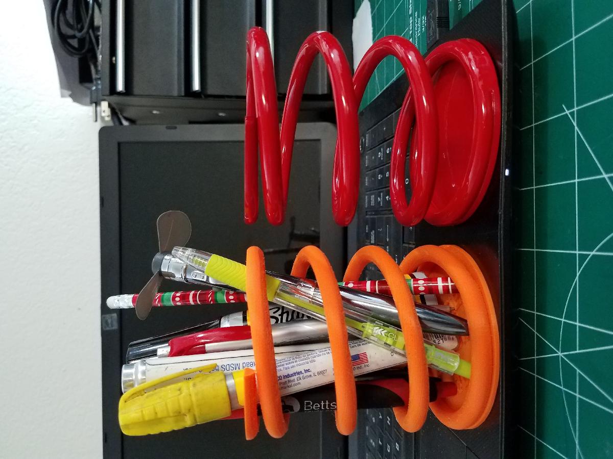 Suporte para caneta com mola em espiral