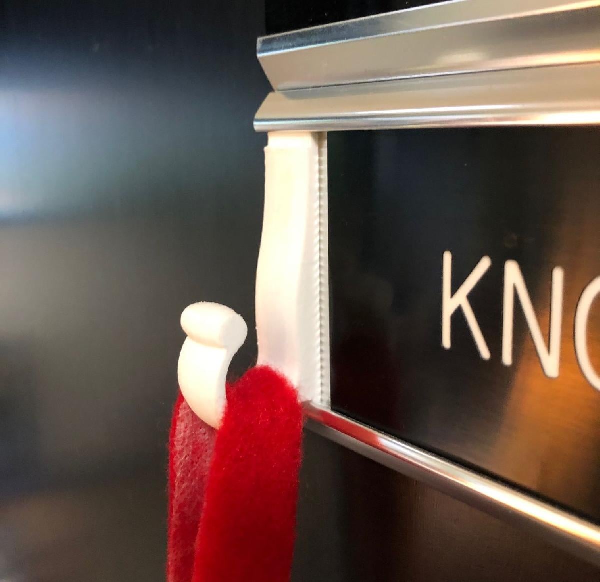 Gancho para meia de Natal na porta do escritorio