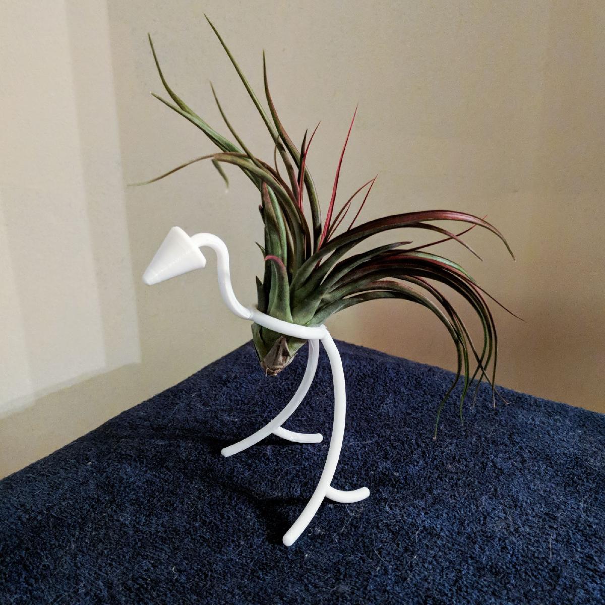 Suporte para plantas em forma de passaro