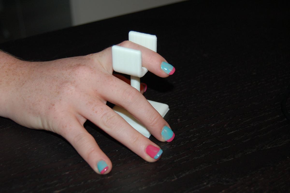 Suporte para os dedos da manicure.