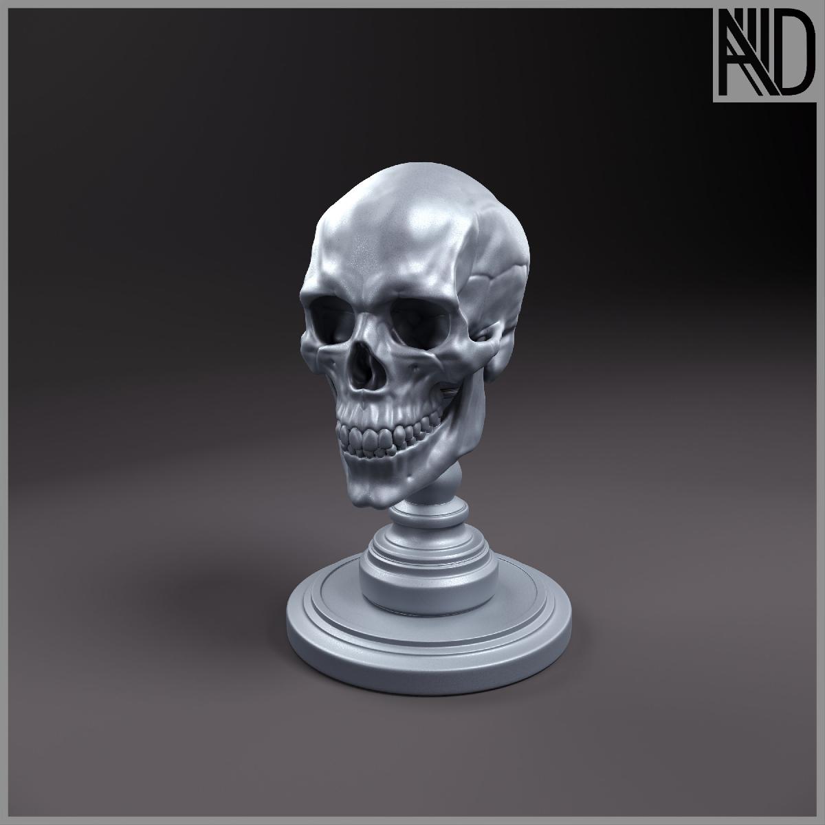 Um chaveiro, uma escultura, uma caveira