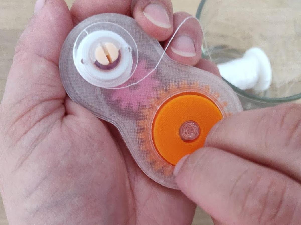 Enrolador de bobinas de costura