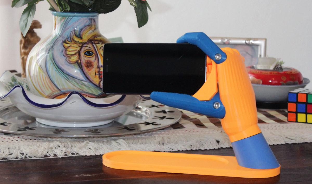 Suporte universal para telefone em forma de mao (tipo gravidade).