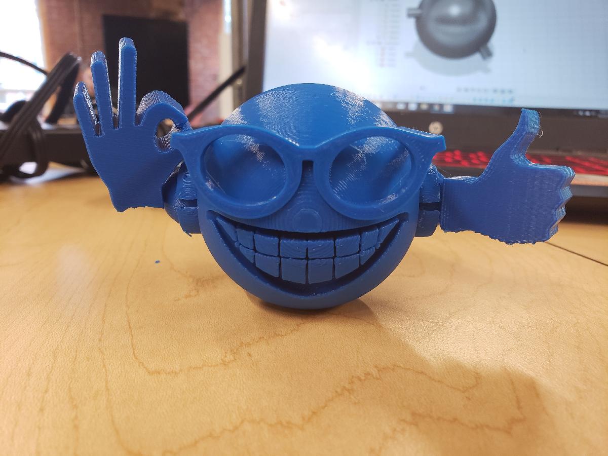 Figura articulada de rosto sorridente com oculos de sol Picardia.