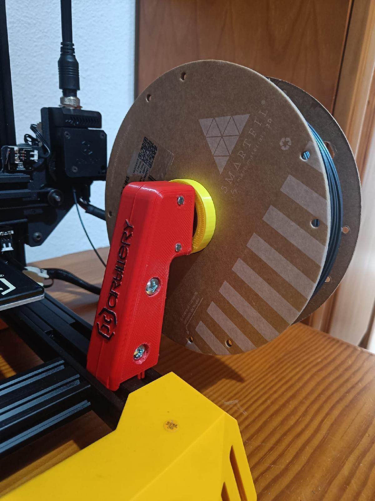 Porta bobinas giratorio