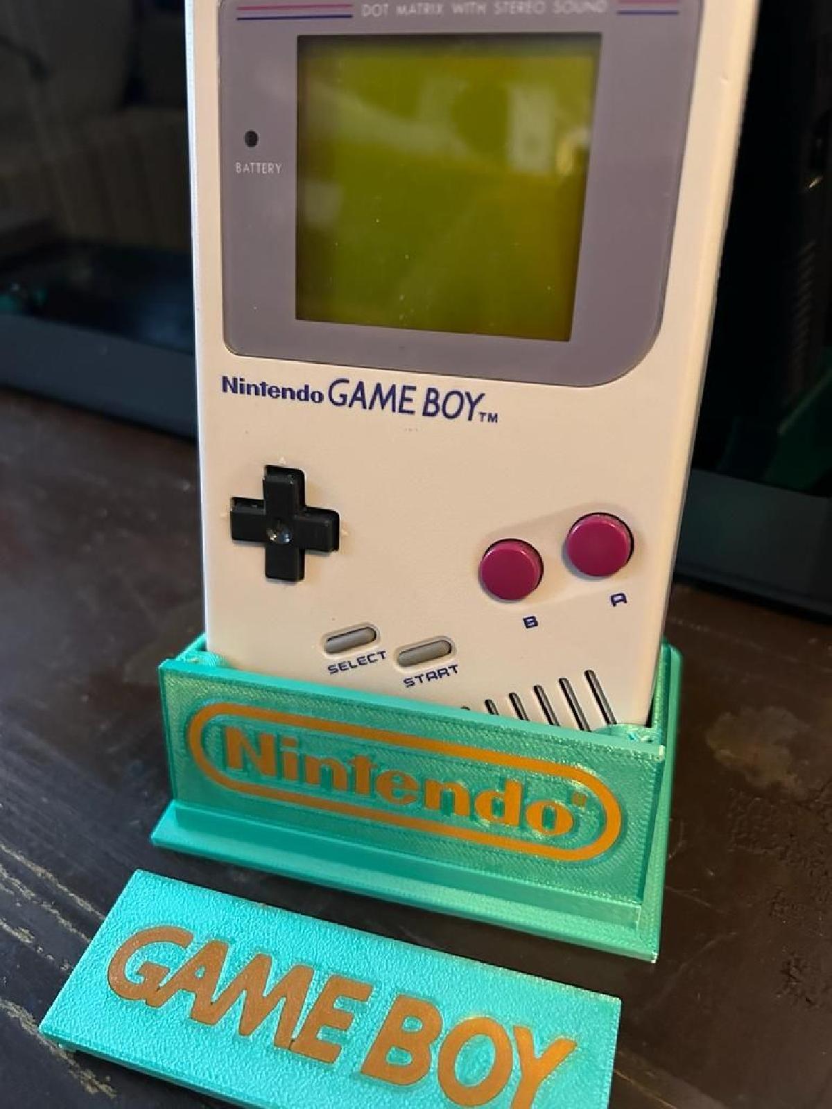 Suporte para Gameboy DMG zerosupp leve com inscricao reversa substituivel.