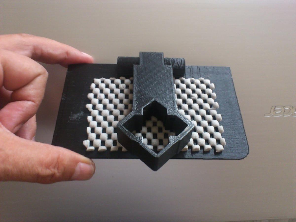 Plataforma dobravel para carregar telefone.