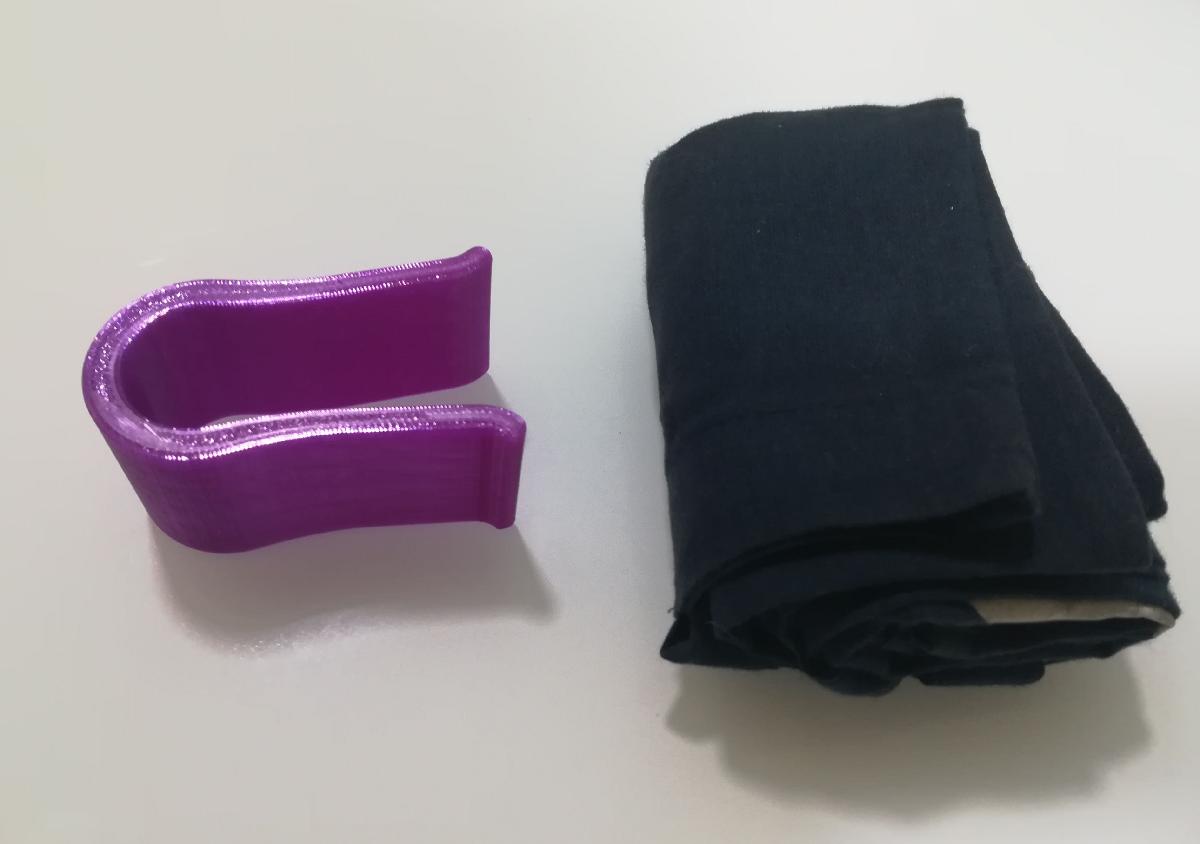 Pinca para dobrar bolsa de tela