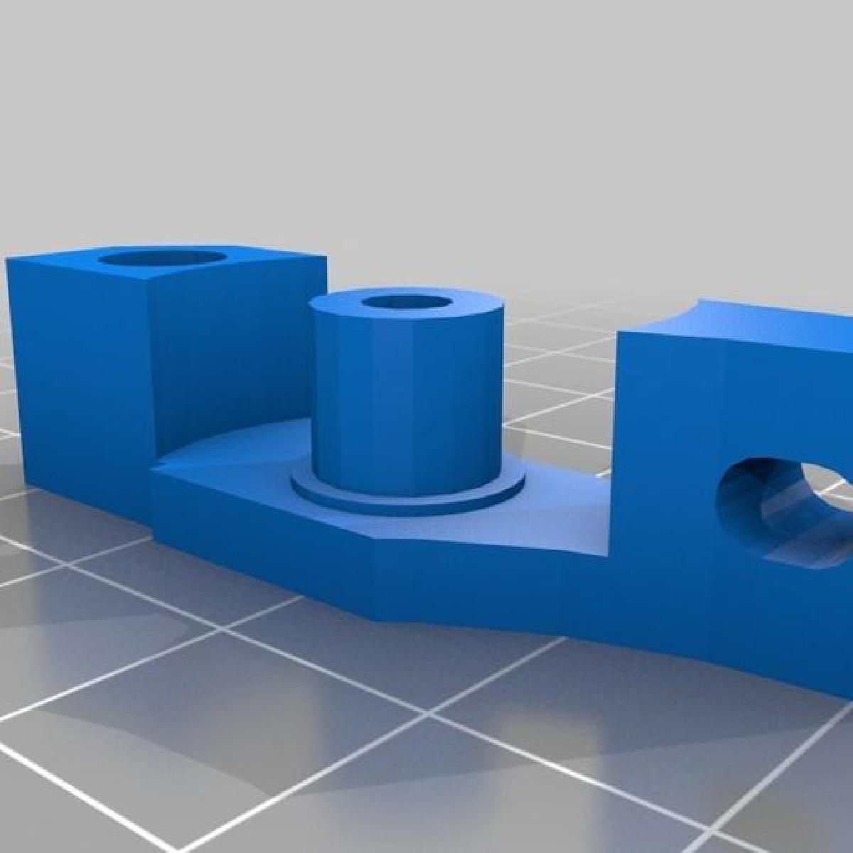 A extremidade distal do suporte do motor de alimentacao.