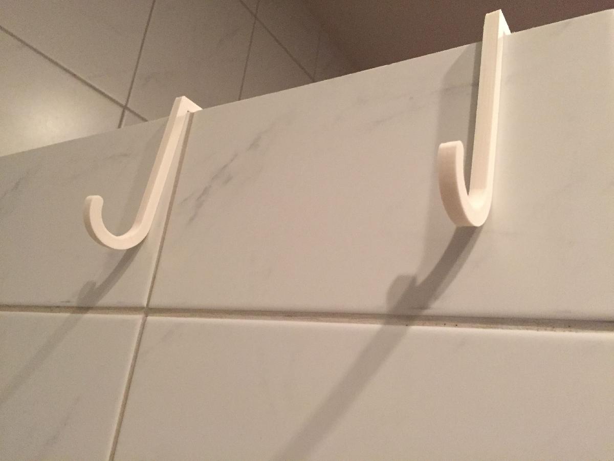 Ganchos para tapete de chuveiro